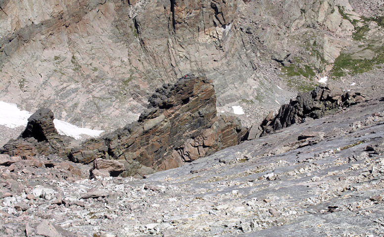 Looking down from the east side the Mount Meeker's upper ridge at climbers topped out on Flying Buttress