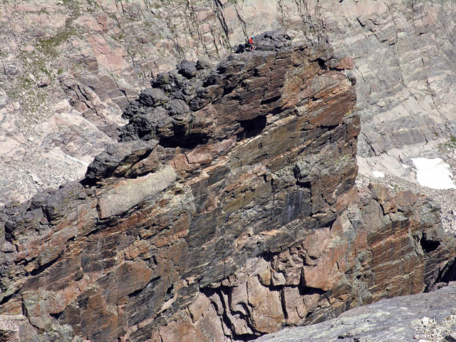 Close up of climbers on the north side of Mount Meeker, topped out on Flying Buttress