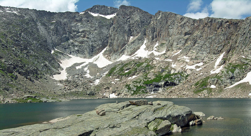 View looking across Crystal Lake at the east face of Fairchild Mountain