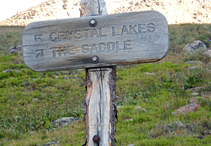 Trail sign at the Crystal Lake and the Saddle trail juction