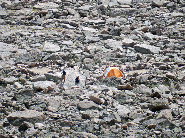 Zoomed in shot of campers in Longs Peak Boulder Field bivouac area from Storm Peak summit