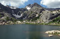 View across Bluebird Lake at the east face of Ouzel Peak in the Wild Basin