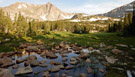 Scenic view of rocky pond with Mt. Alice in the background, Wild Basin, RMNP, Colorado