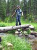Christopher crossing creek below Mirror Lake on single-log bridge - Indian Peaks Wilderness Area, Colorado