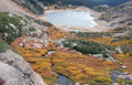 Looking down at Lake Isabelle with alpine fall colors