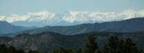 View of snow-capped Sangre de Cristo mountains from Bank area parking, Shelf Road