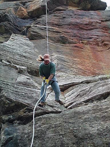 Abseiling down the face of the Big Banana Buttress at the Monkeyface Cliffs