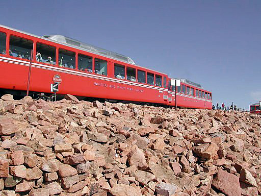 COG rail train arriving at the Pikes Peak summit