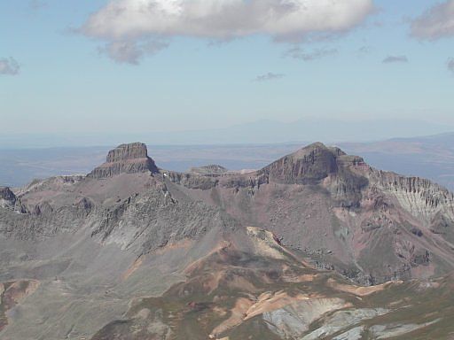 Coxcomb and Redcliff Peaks, both 13,000 foot peaks, as seen looking west from the summit of Uncompahgre Peak