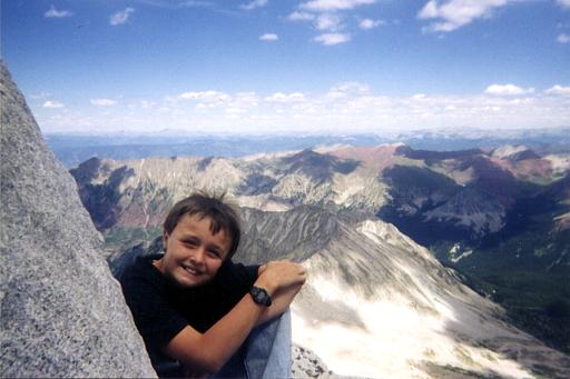 My son, Steve, smiling on top of Snowmass Mountain