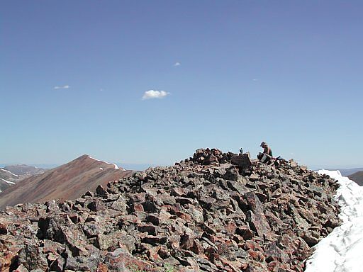 Top of Sunshine Peak with Red Cloud in the background