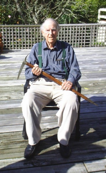 Ed Hillary on his deck in August 2007, holding the Simond Ice Axe he used on Mount Everest in 1953