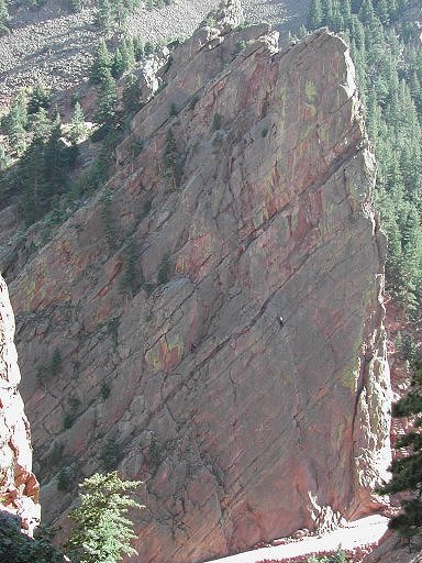 North face of the Basille with Climbers on the Bastille Crack, Eldorado Canyon, Boulder, Colorado