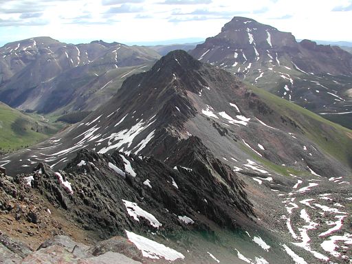 Looking down Wetterhorn’s 4th class east ridge toward Matterhorn Peak, with Uncompahgre Peak in the background.