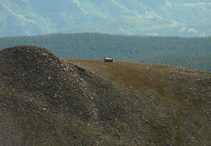 Zoomed in view of Notch Mountain Shelter Cabin from the summit of Mount of the Holy Cross