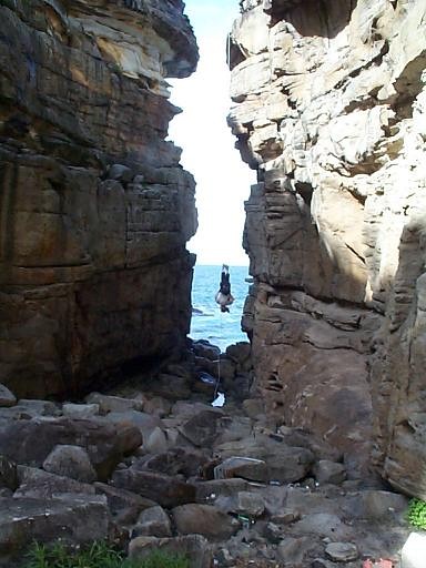 Mark, hanging off the sea cliff in Sydney