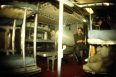Passing time in the sleeping quarters of a Navy cargo ship transport to Puerto Rico for annual qualification dives - taken with a fisheye lens