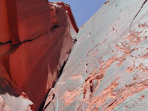 Looking straight up at John on lead, on Meat Hooks, Original Meat Wall, Indian Creek