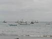 Boats anchored just off the Pacific coast shore line at Playa Hermosa, Costa Rica