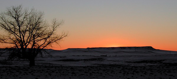 Sunrise alone I25, south of the Colorado/Wyoming border, a few days after a light mid November snow