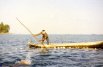 Kuna Indians placing fishing nets at Isla Nalunega in the San Blas Islands